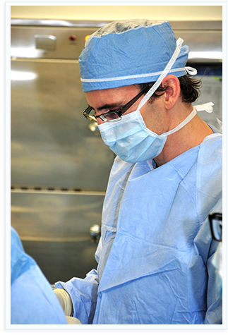 Dr. Will Allanach in a surgical gown